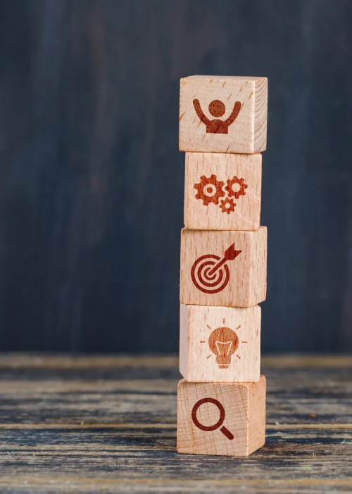 business-strategy-concept-with-wooden-cubes-wooden-grunge-background-side-view